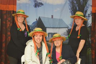 Green Gables - Pam Morey, Alison Vandervelde, Pat Barr and Linda Bates donned their Anne Shirley hats and posed in front of a PEI backdrop, one of the events that will be part of the South Frontenac road rally marking Canada 150 later this year
